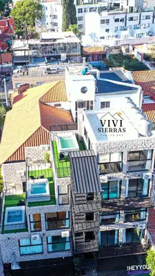 an aerial view of a building in a city at Vivisierras, Duplex a estrenar con pileta privada centro Villa Carlos Paz, 3 dormitorios, 2 baños, vista in Villa Carlos Paz