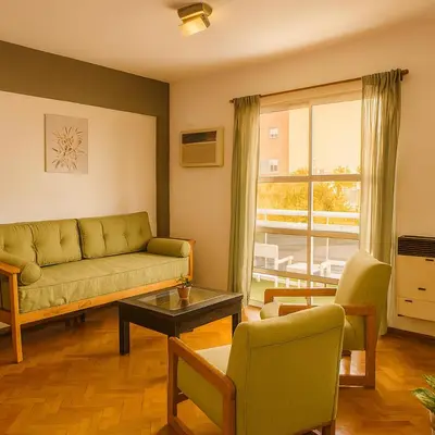 a living room with a couch and a table at Apartamento Andres in Cordoba