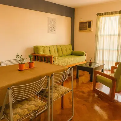 a living room with a couch and a table at Apartamento Andres in Cordoba