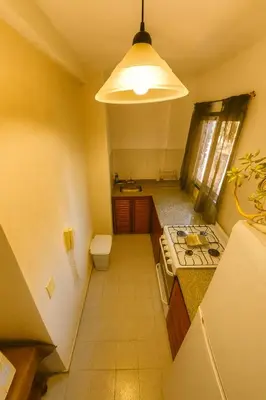 a small kitchen with a sink and a stove at Apartamento Andres in Cordoba
