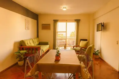 a living room with a table and a couch at Apartamento Andres in Cordoba