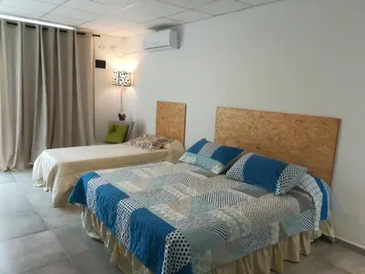a bedroom with two beds in a room at EFE Aparts in Mina Clavero