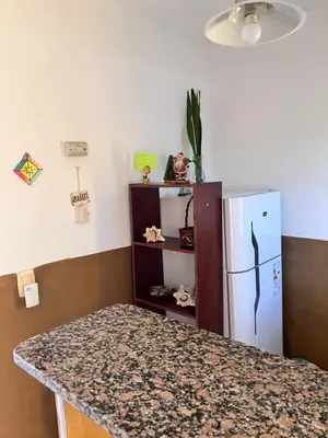 a kitchen with a counter top and a refrigerator at Alojamiento Cba Observatorio in Cordoba