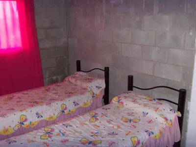 two beds sitting next to each other in a room at Casas Tierra de Ensueno in Villa Parque Siquiman