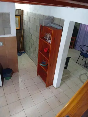 a small cabinet in a room with a tile floor at Casas Tierra de Ensueno in Villa Parque Siquiman