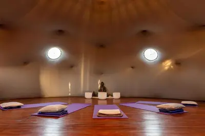 a room with mats on the floor in a room with windows at Bandera Blanca Cabañas & Suites in San Javier
