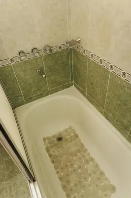 a bath tub filled with lots of rocks at Hotel Petit in Cordoba