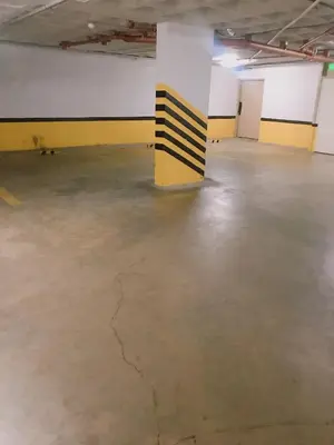 an empty room with yellow and black stripes on the wall at Hotel Petit in Cordoba