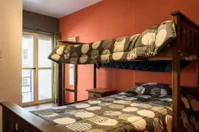 a bedroom with two bunk beds in a room at Apartamento Pueyrredón in Cordoba