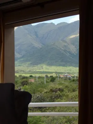 a view of a mountain through a window at Apart Hotel Vista San Lucas in Carpintería