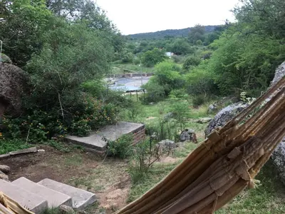 a view of a garden from a hammock at Sol de Bach in Tanti