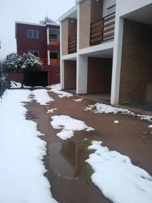 a pile of snow in front of a building at La Villa Inn in Villa Carlos Paz