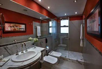 a bathroom with a sink and a toilet and a shower at Windsor Hotel in Cordoba