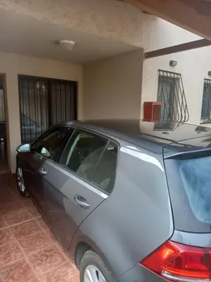 a silver car parked in a garage at Complejo Camila in Villa Carlos Paz