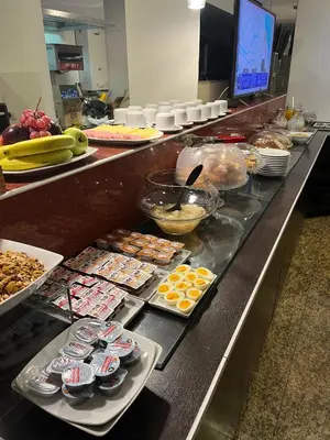 a buffet line with many different types of food at Zoom Apartments Hotel in Cordoba