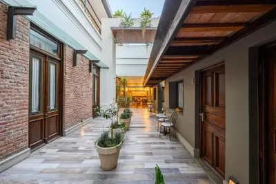 a corridor with plants in pots on a building at Azur Hotel & Spa in Cordoba