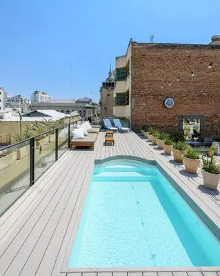a swimming pool on the roof of a building at Azur Hotel & Spa in Cordoba