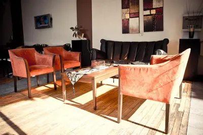 a living room with a table and chairs and a couch at Del Fundador in Cordoba