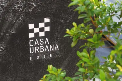 a sign that says casa u dominica hotel at Casa Urbana Hotel in Cordoba