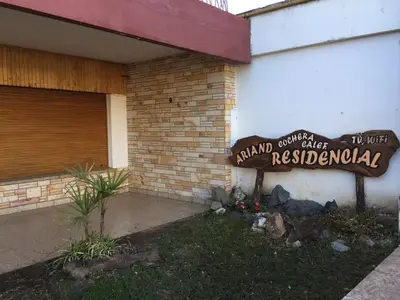 a sign on the side of a building at Residencial Ariand in Santa Rosa de Calamuchita