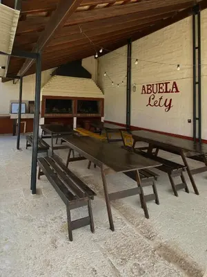 a group of picnic tables sitting in a room at Complejo Abuela Lety in Merlo