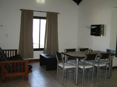 a dining room with a table and chairs at Complejo Abuela Lety in Merlo