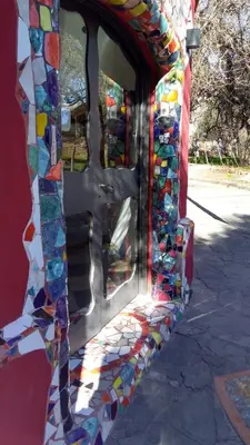 a building made out of stained glass windows at La Neofita in Mina Clavero
