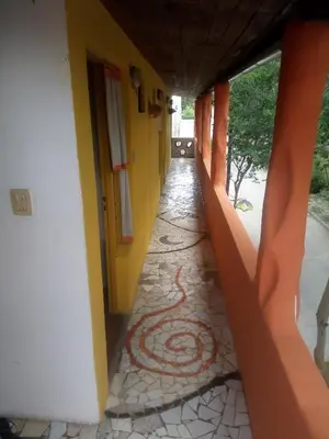 an empty hallway of a house with a tile floor at La Neofita in Mina Clavero