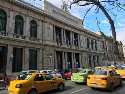 a bunch of taxis parked in front of a building at Cordoba Inn Apart Hotel in Cordoba