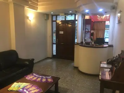 a living room with a couch and a table at Cordoba Inn Apart Hotel in Cordoba