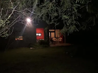 a house at night with a light on it at Casas del Champaquí in San Javier