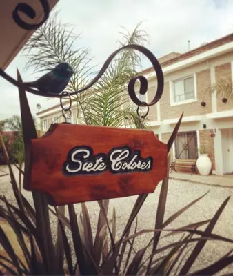 a sign with a bird sitting on top of it at Altos del Tala Deptos - Cabañas in Embalse