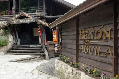 a building with a sign on the side of it at Solares Cumbrecita Hotel & Apart in La Cumbrecita