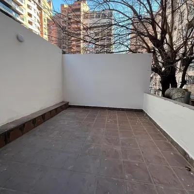 a room with a white wall and a tile floor at Edificio Torre Agora in Cordoba