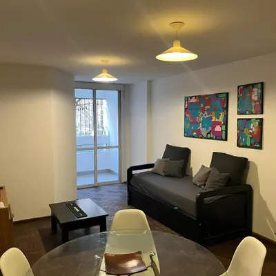 a living room with a couch and a table at Edificio Torre Agora in Cordoba