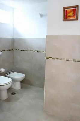 a bathroom with a toilet and a sink at Lomas del Vergel in Los Reartes