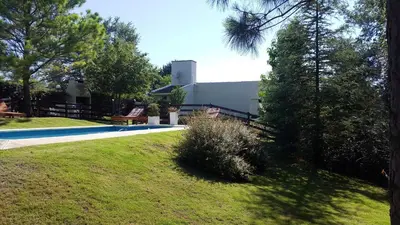 a house with a swimming pool in a yard at Lomas del Vergel in Los Reartes