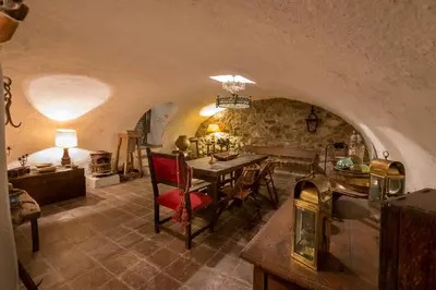 a kitchen and dining room with a table and chairs at Virreinato Hotel Boutique in Cordoba