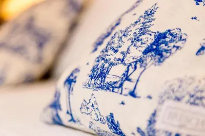 a blue and white plate with a tree on it at Virreinato Hotel Boutique in Cordoba