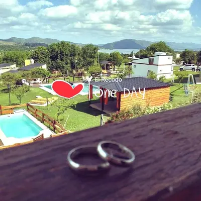 a pair of wedding rings sitting on top of a table at Cabañas el Recodo de Potrero in Potrero de Garay