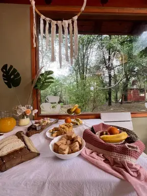 a table with a bunch of food on it at Posada Vieja Estancia in Santa Rosa de Calamuchita