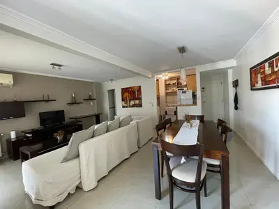 a living room with a couch and a table at Departamento luminoso con balcón, aire y Wi-FI-Nueva Córdoba in Cordoba