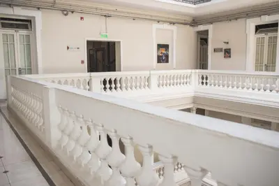 a staircase in a building with white walls and ceilings at Gran Hotel Victoria Cordoba Argentina in Cordoba
