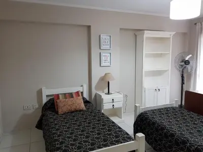 a bedroom with a bed and a fan at Juventus in Cordoba