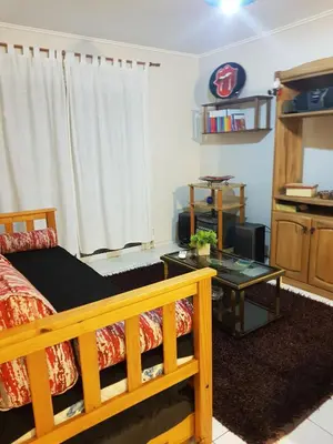 a bedroom with a bed and a coffee table at Juventus in Cordoba