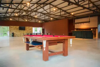 a large ping pong table in a large room at El Zuriaco in Santa Rosa de Calamuchita