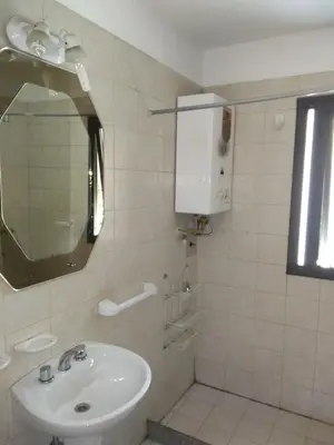 a bathroom with a sink and a mirror at Balcarce Suits PB in Bell Ville