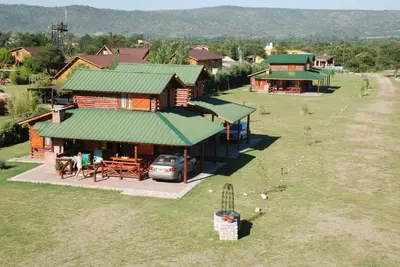 an overhead view of a house with a car parked in front at Las Cortaderas Cabañas de Tronco in Nono