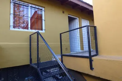 a staircase leading up to a building with a window at Departamento Centrico Laprida in Cordoba