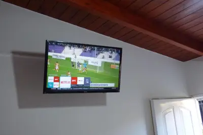 a flat screen tv hanging on a wall at Departamento Centrico Laprida in Cordoba
